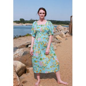 Garden Party Blue Smocked Midi Dress offers at $333.58 in Stein Mart