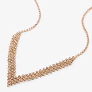Gold Rhinestone Chevron Zig Zag Statement Necklace offers at $6.8 in Claire's